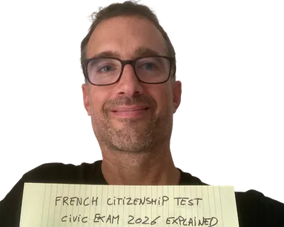 Yann smiling behind a yellow notepad sheet that reads "French citizenship test: civic exam 2026 explained"